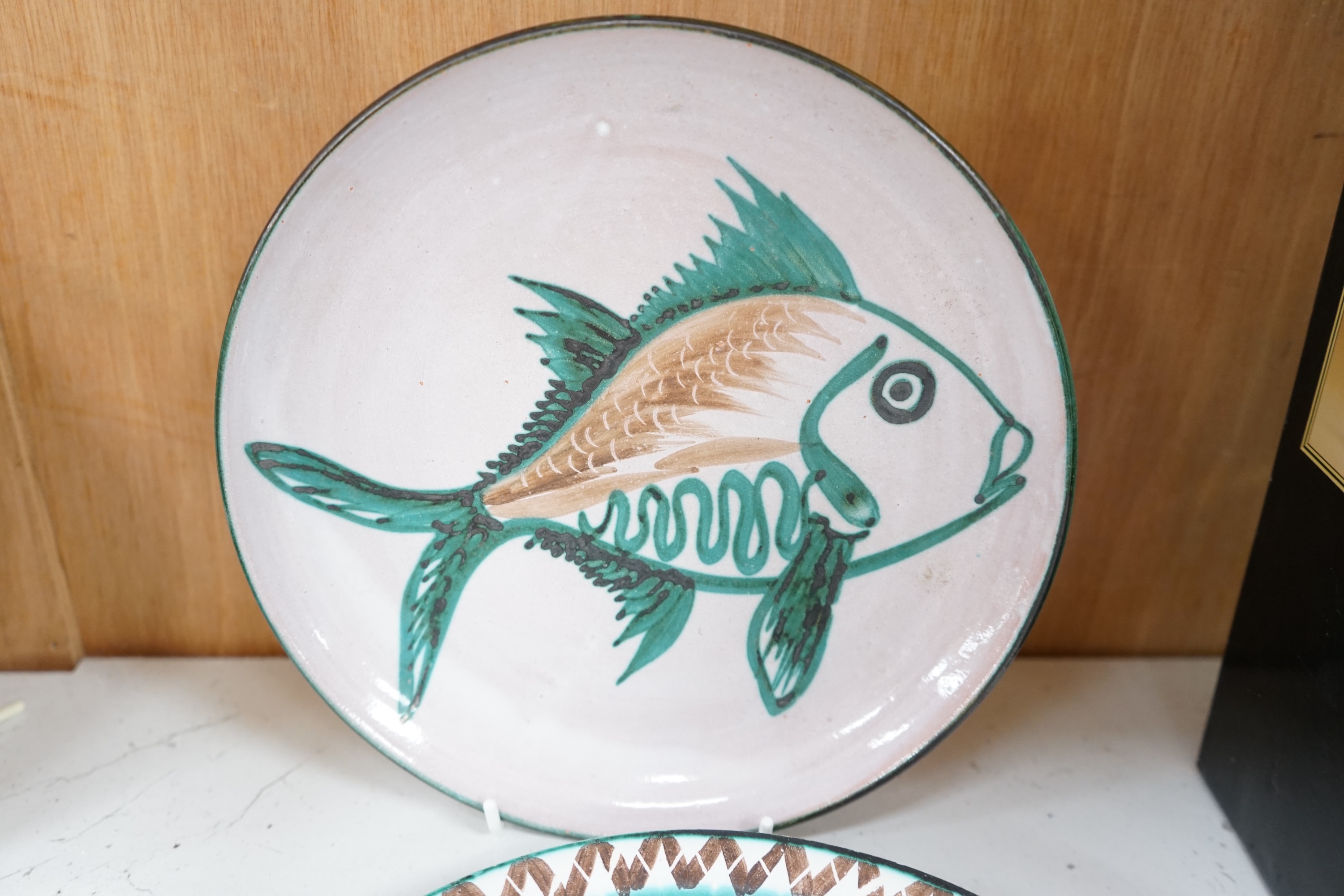 A mixed collection fish and flower designed French pottery dinnerware by Robert Picault, dishes 23cm diameter. Condition - variable